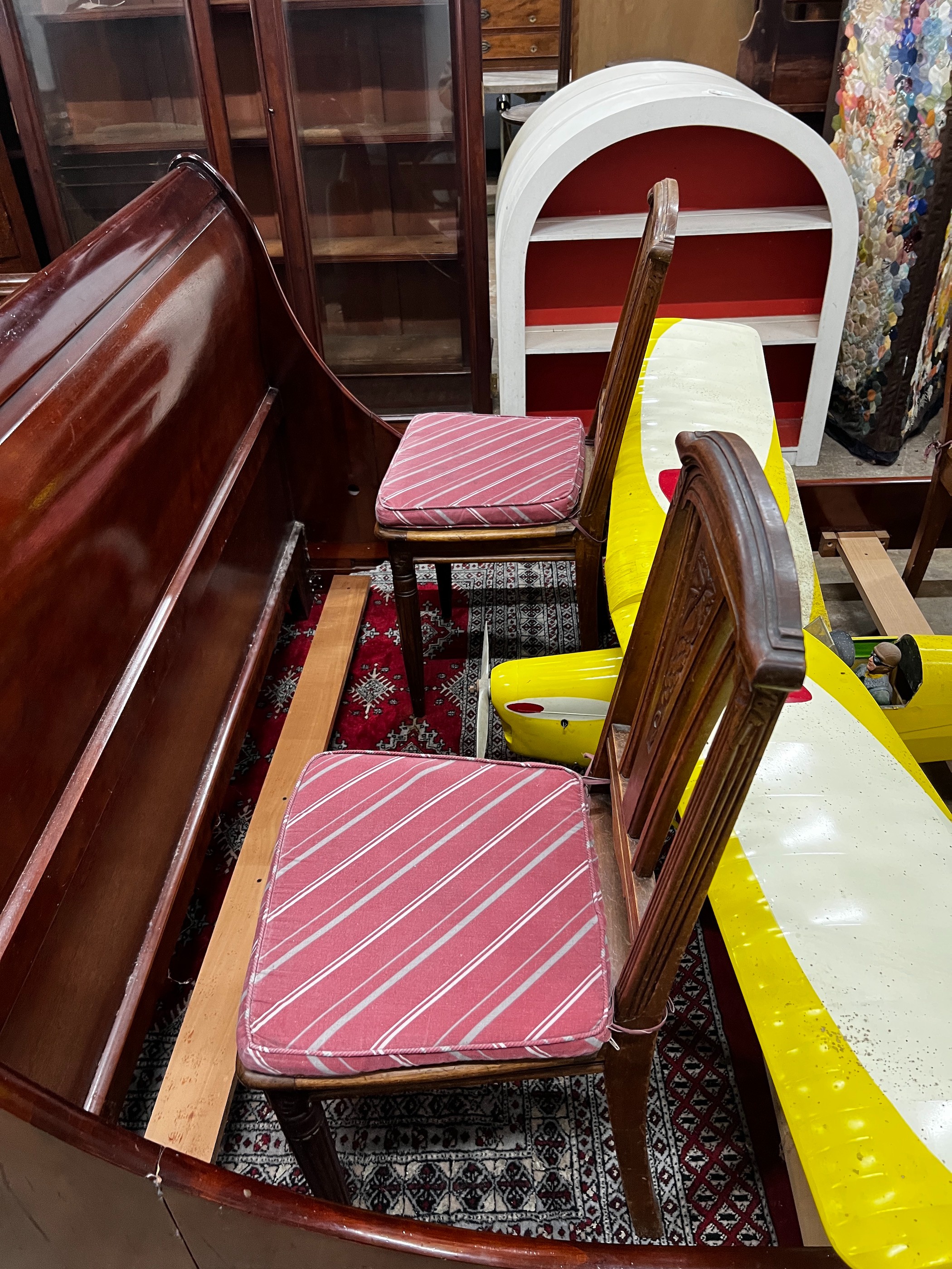 A set of four early 20th century French walnut dining chairs